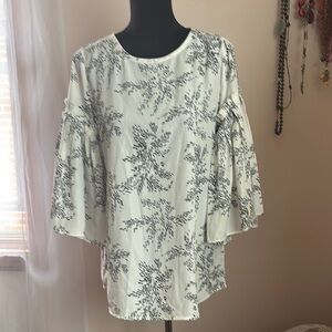 White Blouse with Flutter Sleeves and Ruffled Style